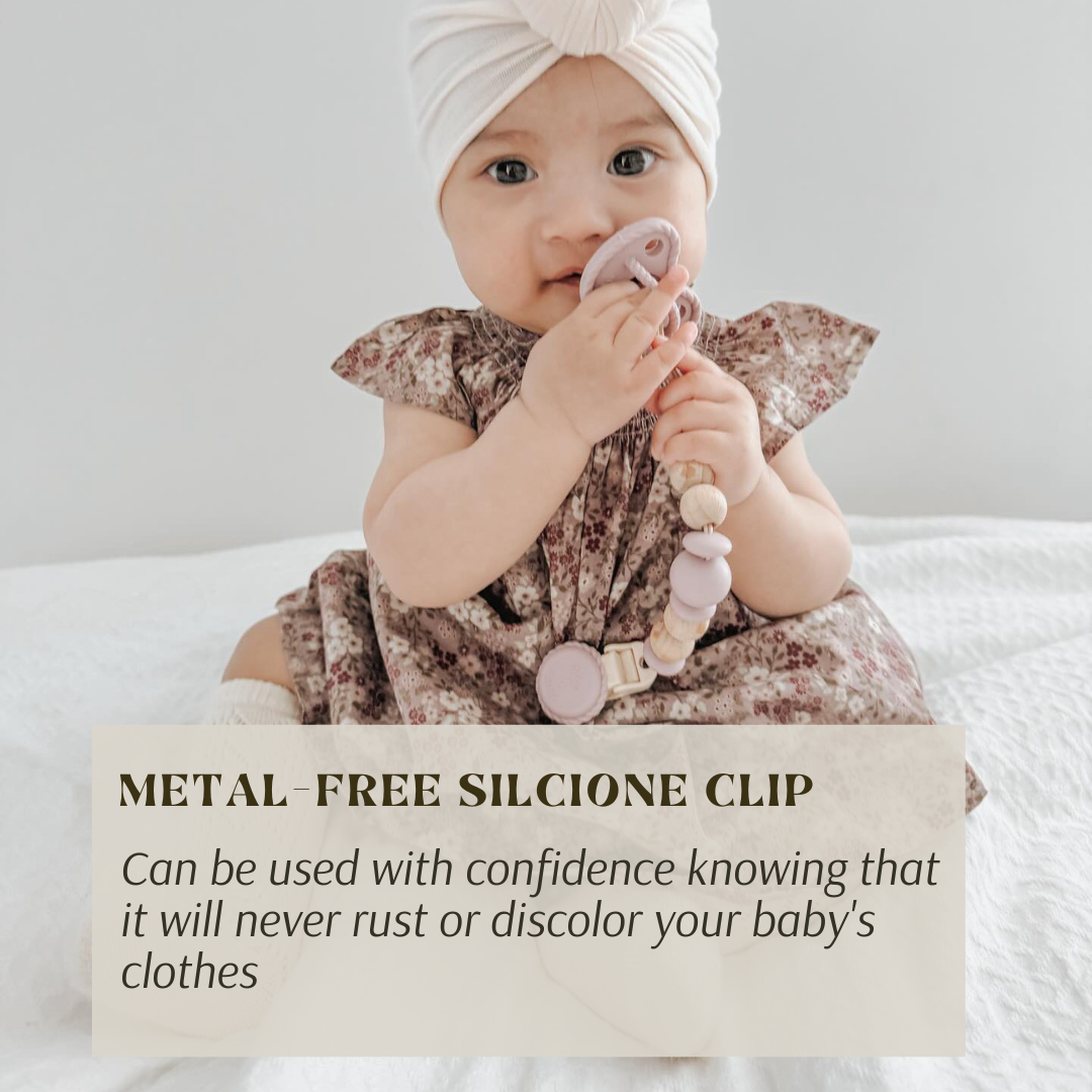 Baby using mila & Lulu metal-free beaded pacifier clips