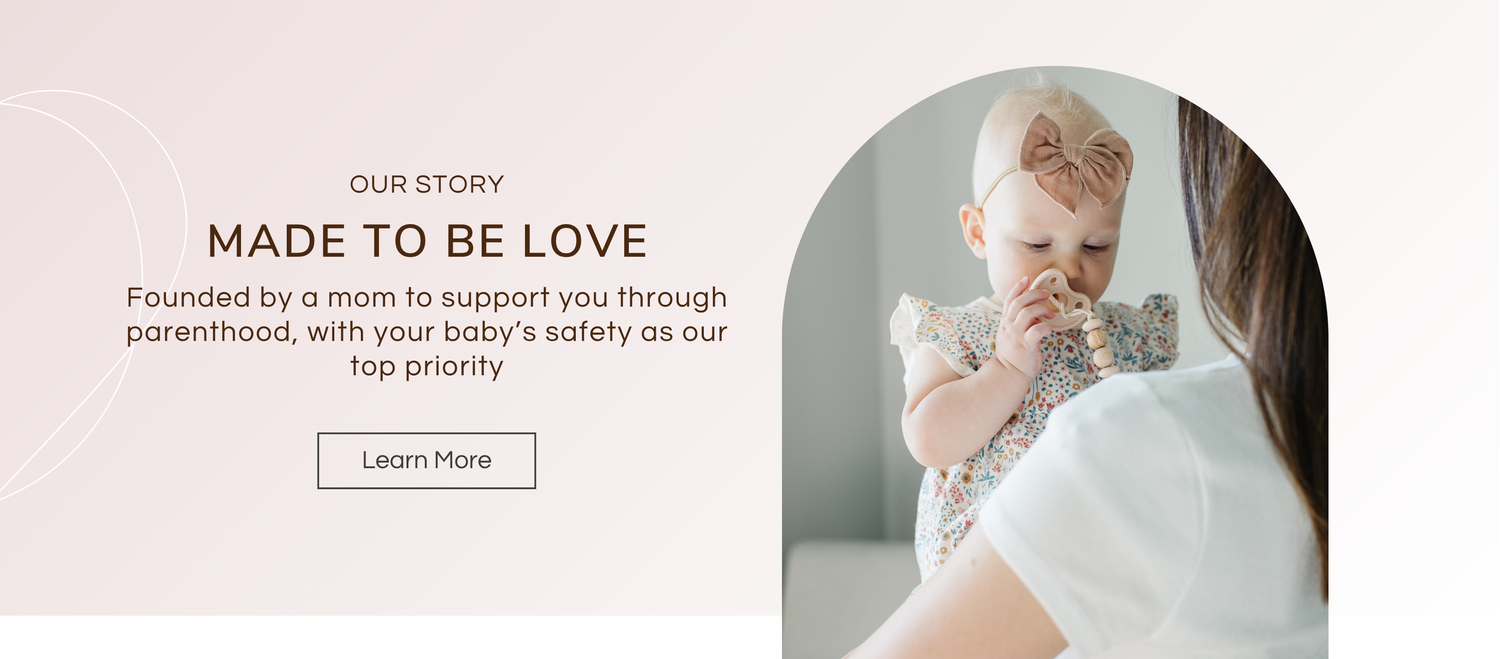 Woman hugging baby, “made to be love” - Mila and Lulu ( pacifiers)