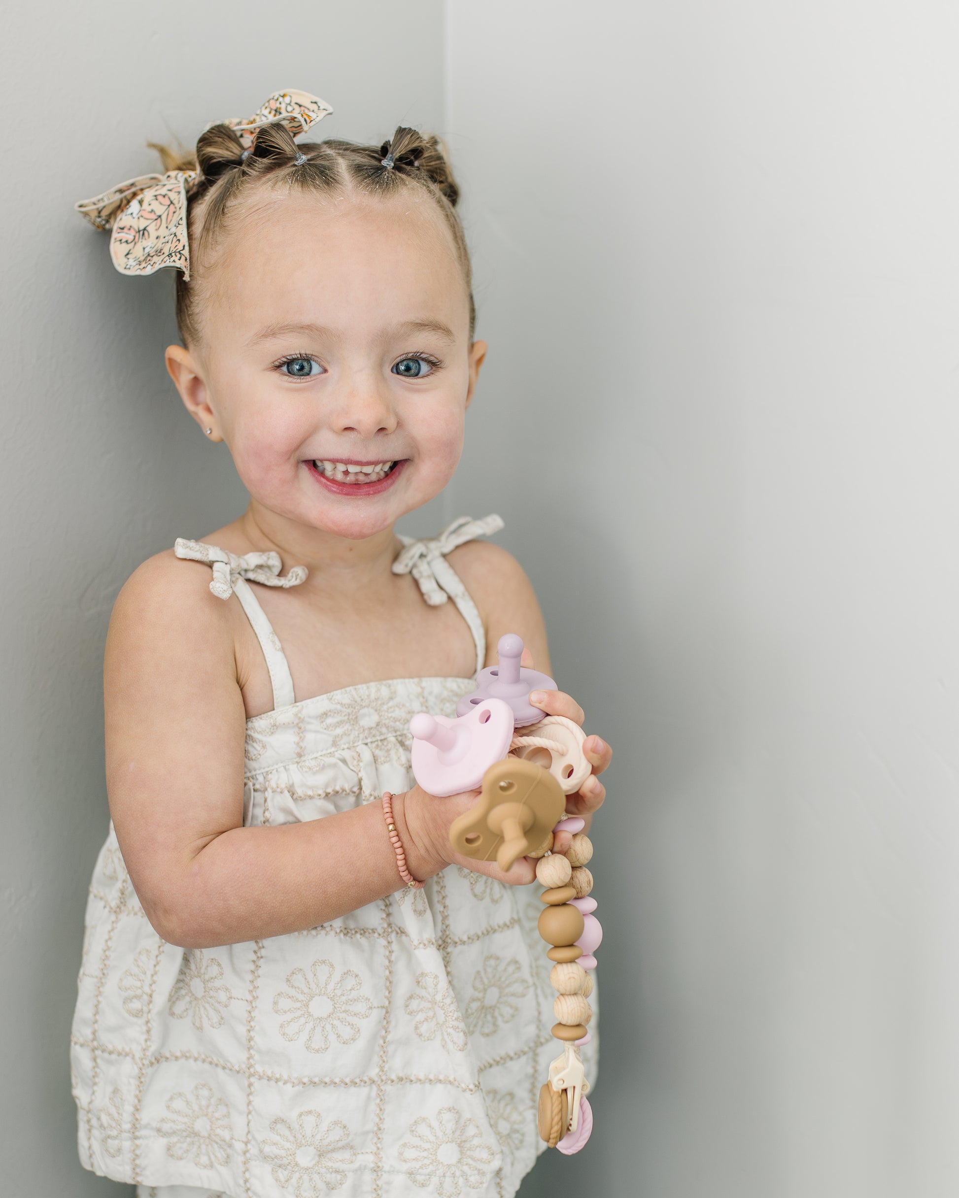 Neutral colors minimal baby pacifiers and clips